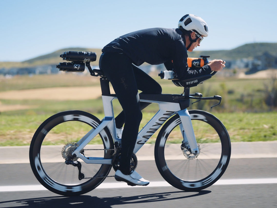 Triathlete riding with the Beta System behind the saddle