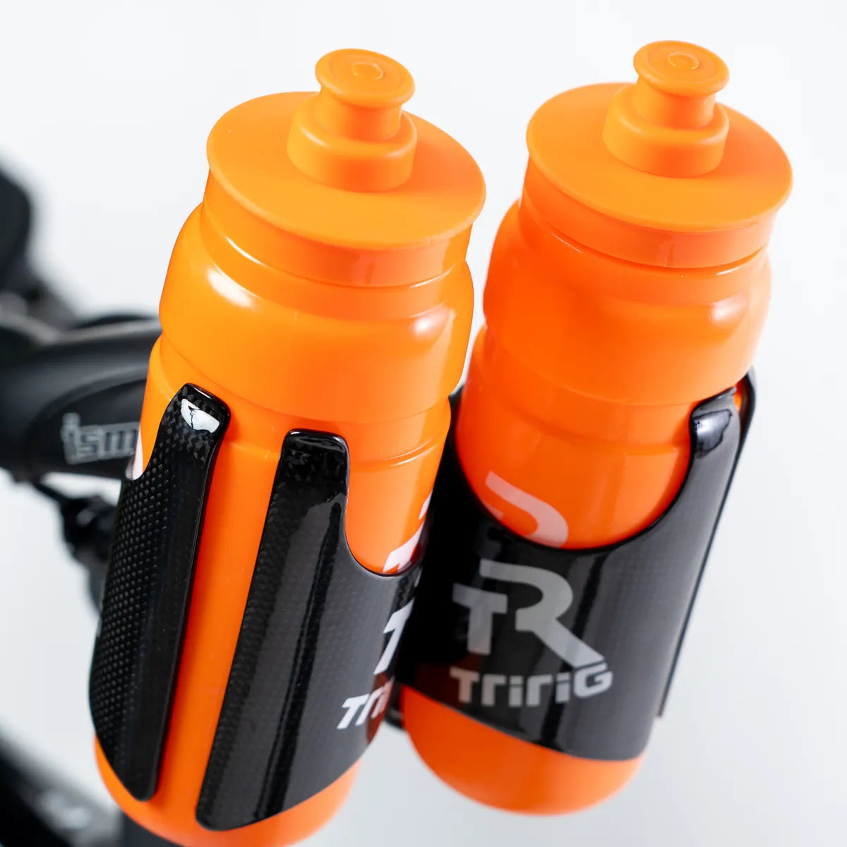 Two orange TR Water Bottles in Kappa Carbon Cages